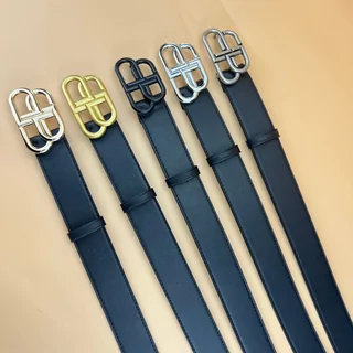 Five dark leather belts laid side by side, each with a different metal buckle