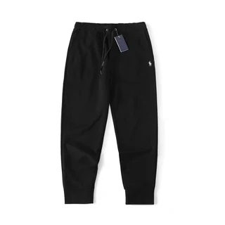 Black fleece joggers with a drawstring waist and elasticated cuffs, photographed flat on white